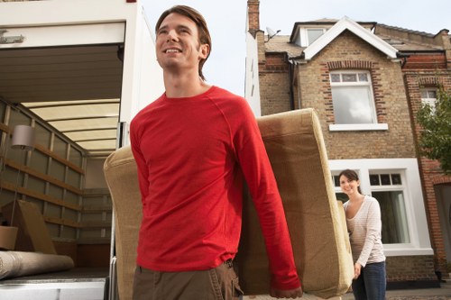 Packed belongings and furniture loading during a West Kensington move