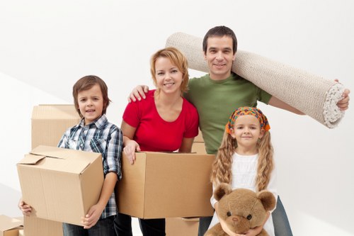 Office furniture and boxes organised for a commercial move in Westkensington