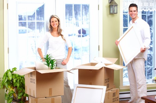 Removal team loading boxes and furniture for a West Kensington move