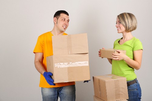 Careful unpacking in a Westkensington flat after relocation